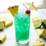Liquid Marijuana cocktail in a tall glass with pineapple wedge and maraschino cherry garnish